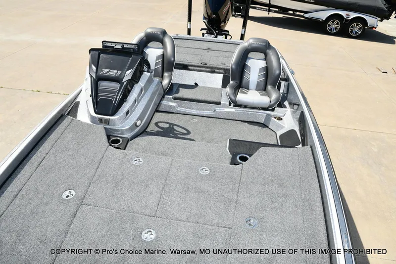 Slide: The Image of 2020 Nitro Z21 Pro boat interior with gray seating and carpeted deck. - 10