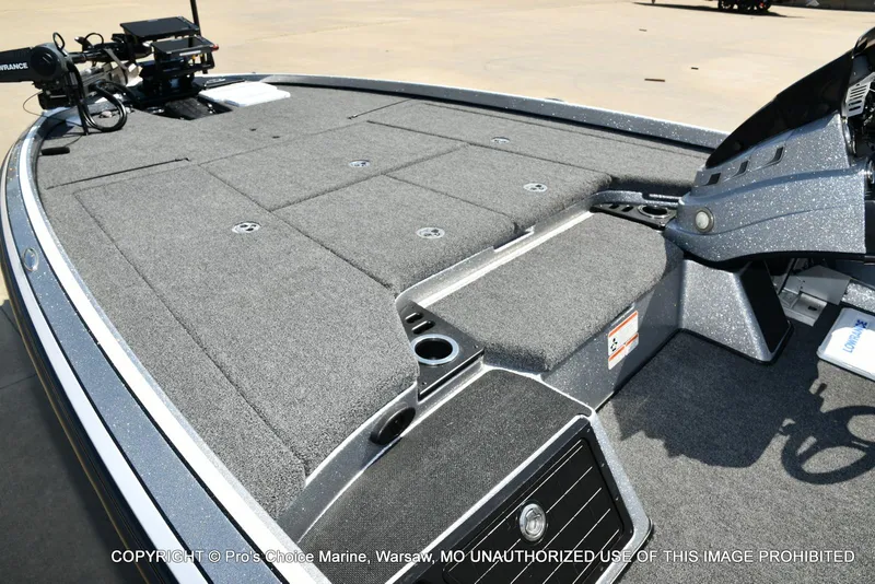 Slide: The Image of 2020 Nitro Z21 Pro boat deck with carpeted surface and storage compartments. - 11