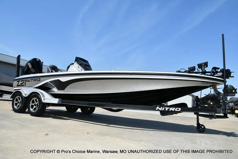Slide: The Image of 2020 Nitro Z21 Pro boat on trailer, sleek design, parked outdoors under clear sky. - 14