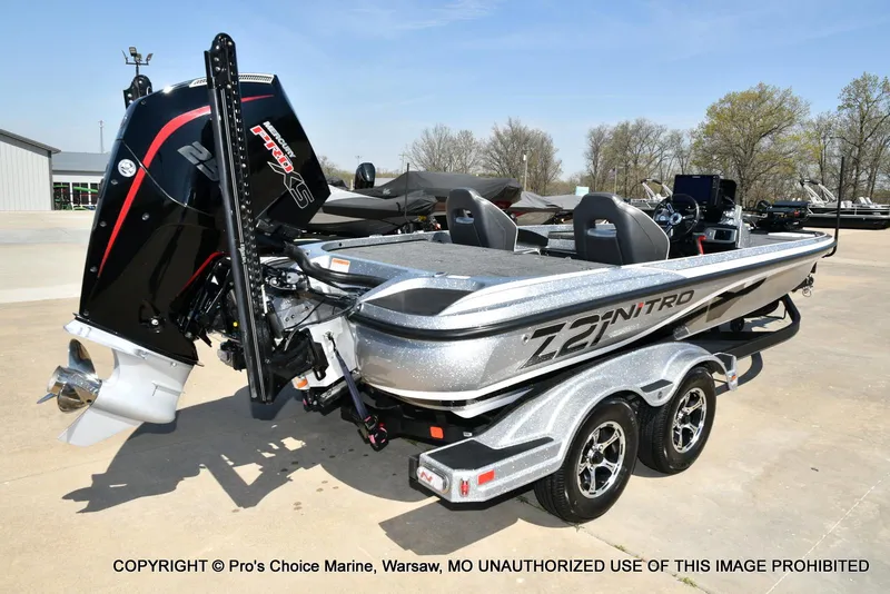 Slide: The Image of 2020 Nitro Z21 Pro boat with powerful engine, parked on a trailer in a sunny outdoor setting. - 17