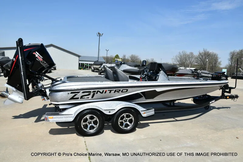 Slide: The Image of 2020 Nitro Z21 Pro boat on trailer, silver finish, parked outdoors. - 19