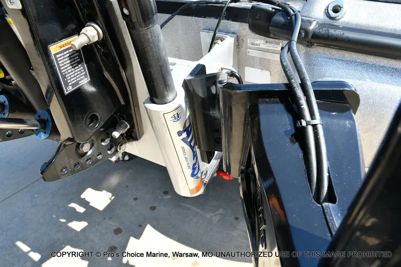 Slide: The Image of 2020 Nitro Z21 Pro boat engine detail with hydraulic components and cables. - 22