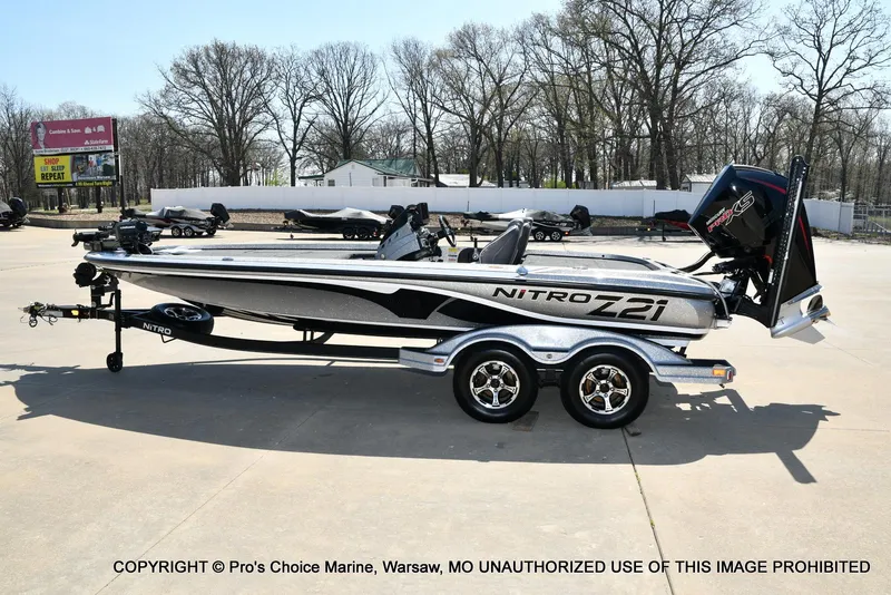 Slide: The Image of 2020 Nitro Z21 Pro bass boat parked outdoors on a sunny day. - 27
