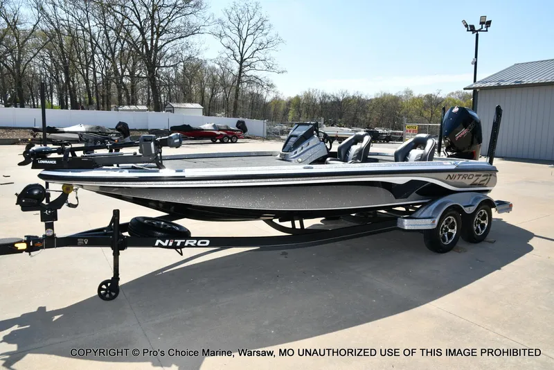 Slide: The Image of 2020 Nitro Z21 Pro fishing boat on trailer, parked outdoors. - 28