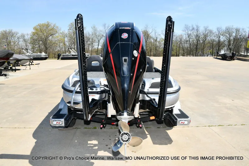 Slide: The Image of 2020 Nitro Z21 Pro boat, rear view with powerful outboard motor, parked outdoors. - 3