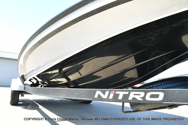 Slide: The Image of 2020 Nitro Z21 Pro boat on trailer, close-up view of hull and branding. - 33