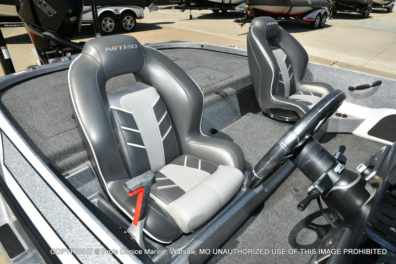 Slide: The Image of 2020 Nitro Z21 Pro boat interior with gray seats and steering wheel. - 37