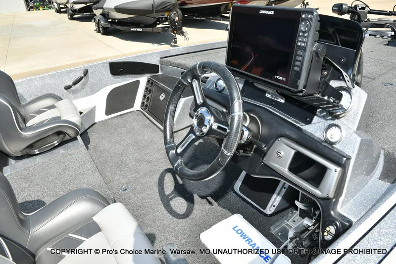Slide: The Image of 2020 Nitro Z21 Pro boat interior with steering wheel and Lowrance electronics. - 40