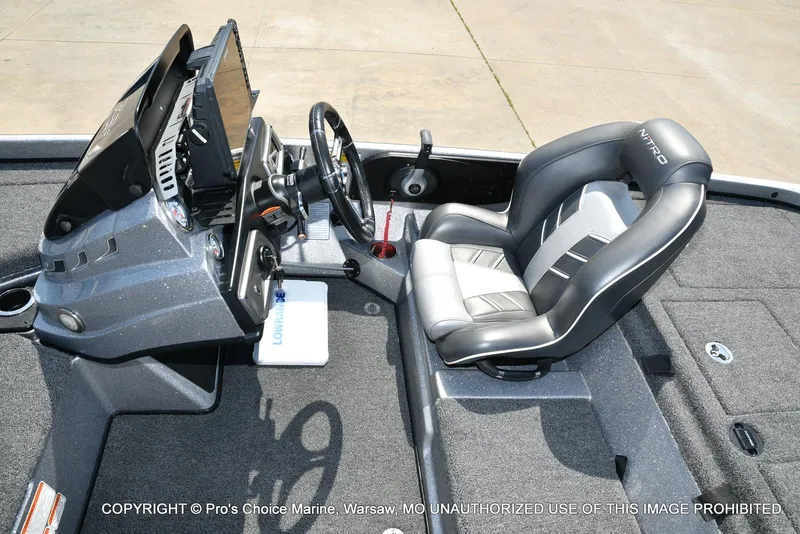 Slide: The Image of 2020 Nitro Z21 Pro boat interior with steering console and cushioned seat. - 46