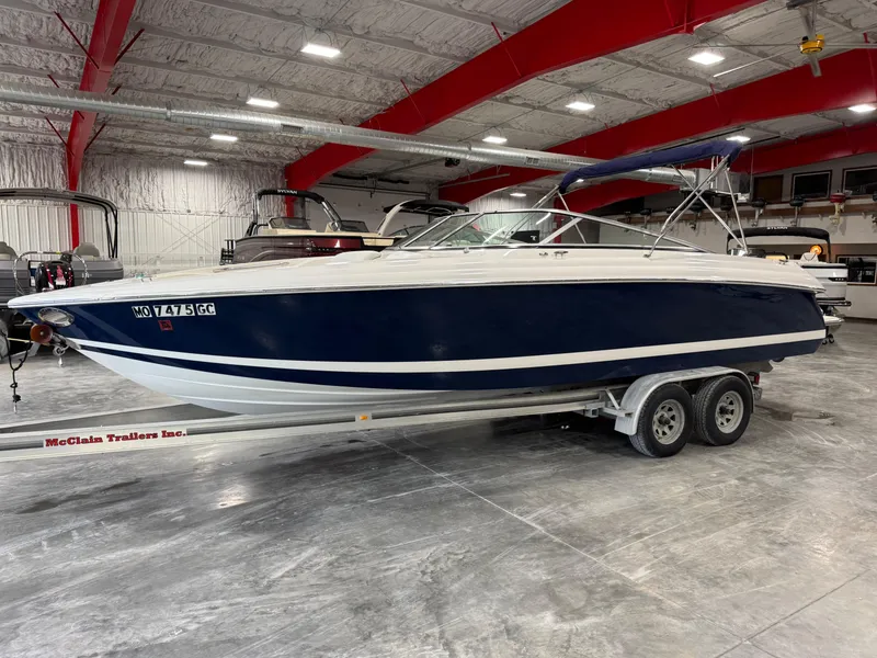Slide: The Image of 2004 Cobalt 262 BR boat on trailer in indoor showroom. - 1
