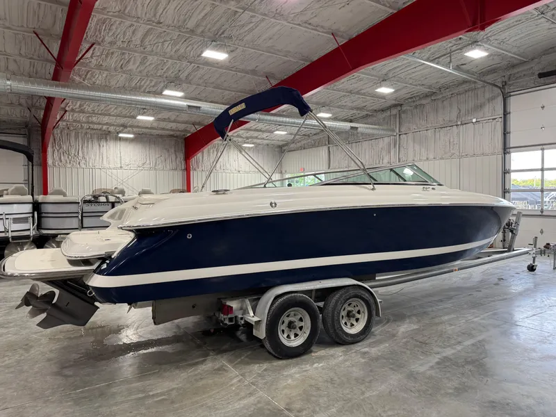 Slide: The Image of 2004 Cobalt 262 BR boat on trailer in indoor storage facility. - 3