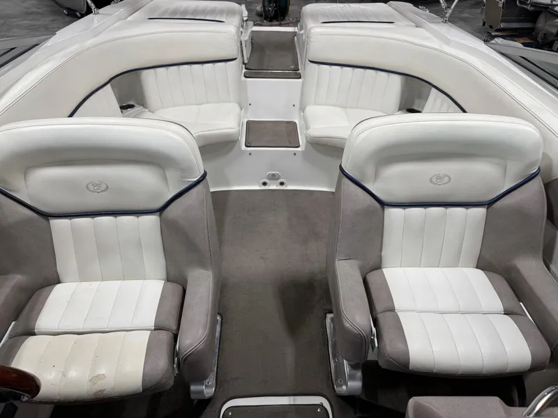Slide: The Image of Interior of a 2004 Cobalt 262 BR boat with white and gray seating. - 7