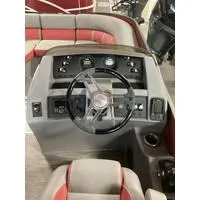 Slide: The Image of 2023 Bennington L Bowrider 23 Swingback dashboard with steering wheel and controls. - 3