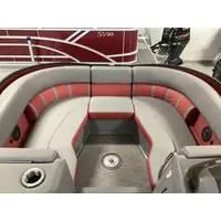 Slide: The Image of 2023 Bennington L Bowrider 23 Swingback interior with red and gray seating. - 4