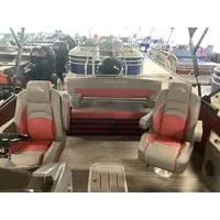 Slide: The Image of 2023 Bennington L Bowrider 23 Swingback interior with red and gray seating. - 5