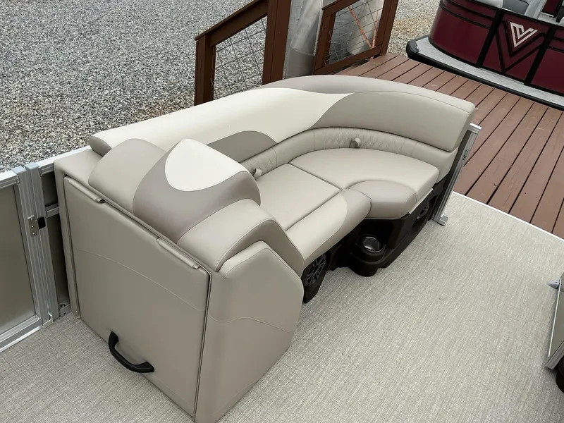Slide: The Image of Luxurious seating on 2025 Avalon LSZ 23 Quad Lounger pontoon boat, featuring beige upholstery. - 2