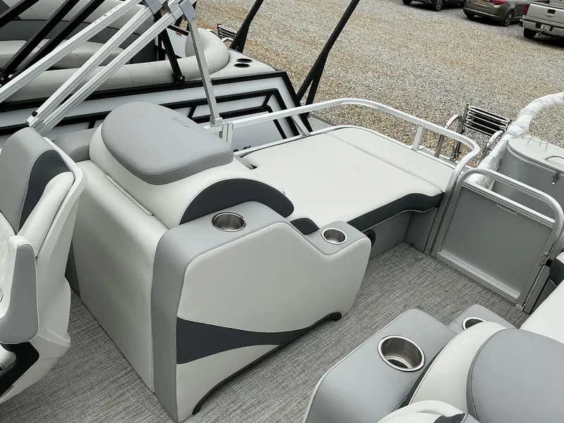 Slide: The Image of 2025 Avalon LSZ 23 Rear Lounger with sleek seating and cup holders on a pontoon boat. - 4