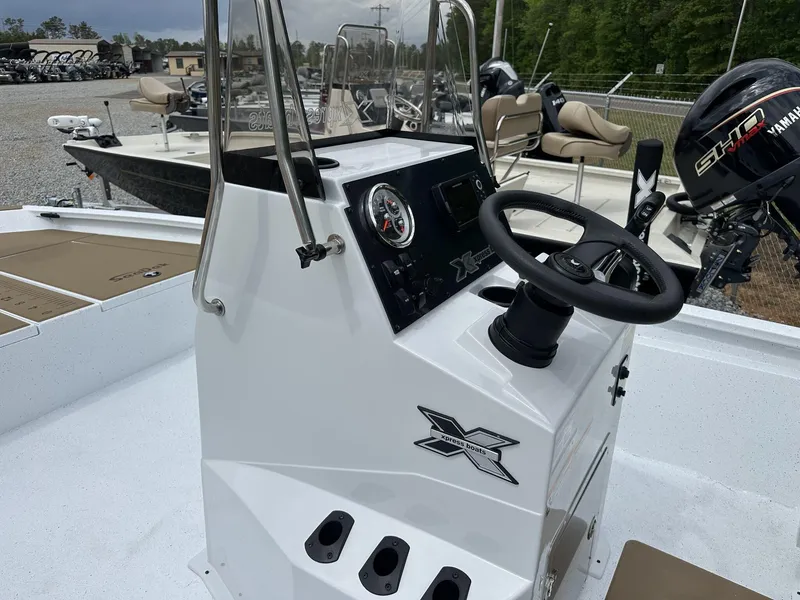 Slide: The Image of 2025 Xpress Hyper-Lift Bay Series 210 BAY-175 HP boat console with steering wheel and controls. - 7