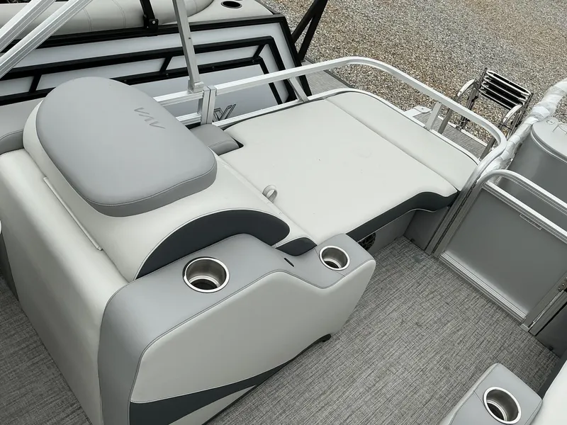 Slide: The Image of 2025 Avalon LSZ 23 Rear Lounger with sleek gray seating and cup holders. - 12