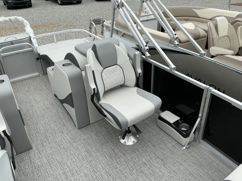 Slide: The Image of 2025 Avalon LSZ 23 Rear Lounger boat interior with plush seating and modern design. - 5