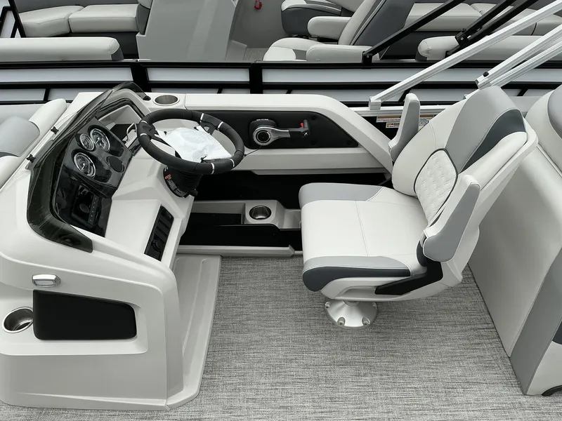 Slide: The Image of 2025 Avalon LSZ 23 Rear Lounger boat interior with modern helm and comfortable seating. - 9