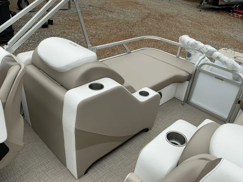 Slide: The Image of 2025 Avalon LSZ 23 Rear Lounger interior with beige and white seating, cup holders, and railing. - 11