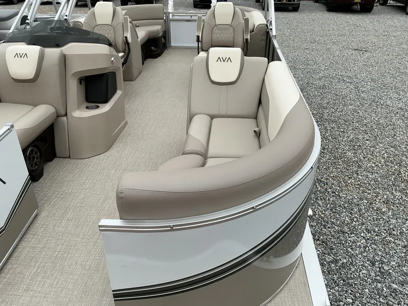 Slide: The Image of 2025 Avalon LSZ 23 Quad Lounger with beige seating and modern design on gravel surface. - 12