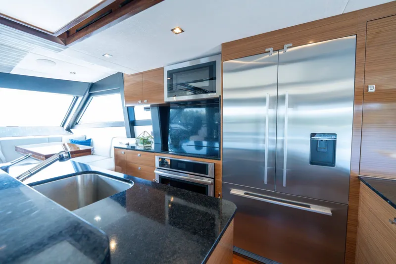Slide: The Image of Luxurious kitchen interior of 2018 Ocean Alexander 70E Motoryacht with modern appliances. - 23