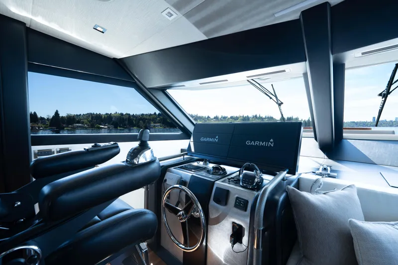 Slide: The Image of 2018 Ocean Alexander 70E Motoryacht helm with Garmin navigation system and luxurious seating. - 25