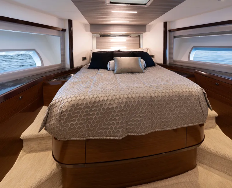 Slide: The Image of Luxurious bedroom in 2018 Ocean Alexander 70E Motoryacht with elegant bedding and ocean views. - 28