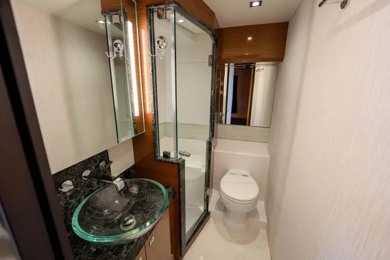 Slide: The Image of Luxurious bathroom in 2018 Ocean Alexander 70E Motoryacht with glass sink and shower. - 29