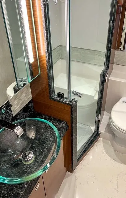 Slide: The Image of Luxurious bathroom in 2018 Ocean Alexander 70E Motoryacht with glass sink and shower. - 30