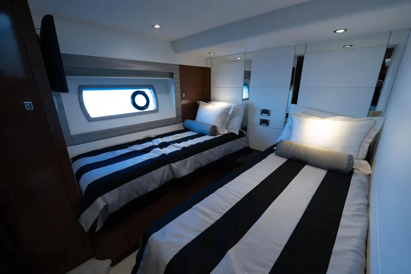 Slide: The Image of 2018 Ocean Alexander 70E Motoryacht cabin with twin beds and modern decor. - 31