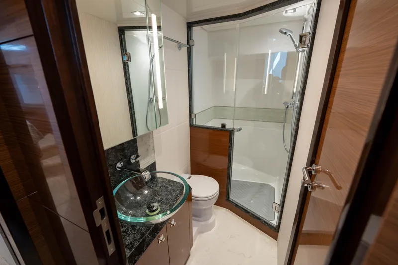 Slide: The Image of Luxurious bathroom in 2018 Ocean Alexander 70E Motoryacht with glass shower and modern sink. - 32