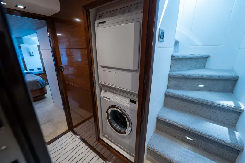 Slide: The Image of Laundry area and stairs inside 2018 Ocean Alexander 70E Motoryacht. - 34