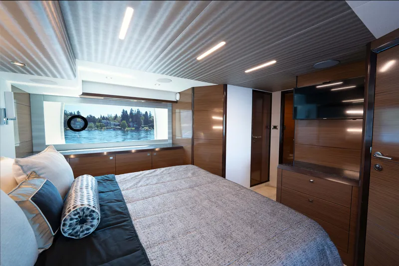 Slide: The Image of Luxurious bedroom interior of 2018 Ocean Alexander 70E Motoryacht with modern design and scenic window view. - 36
