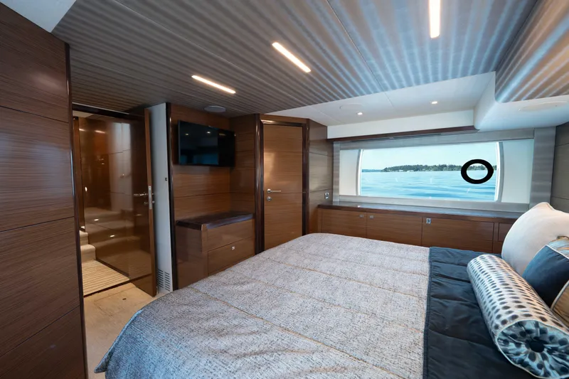 Slide: The Image of Luxurious 2018 Ocean Alexander 70E Motoryacht bedroom with elegant wood finishes and ocean view. - 37