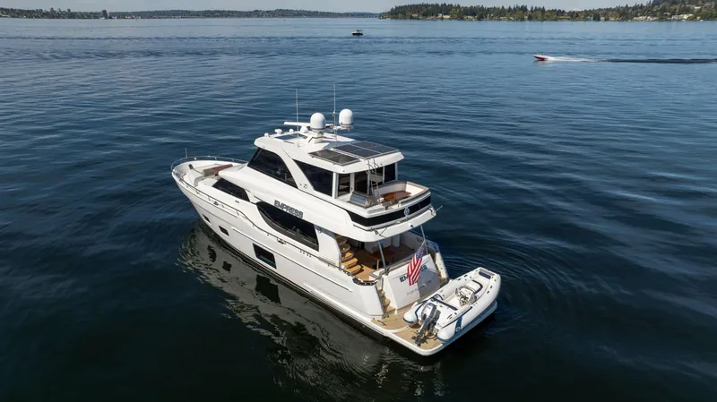 Slide: The Image of 2018 Ocean Alexander 70E Motoryacht cruising on calm waters. - 4