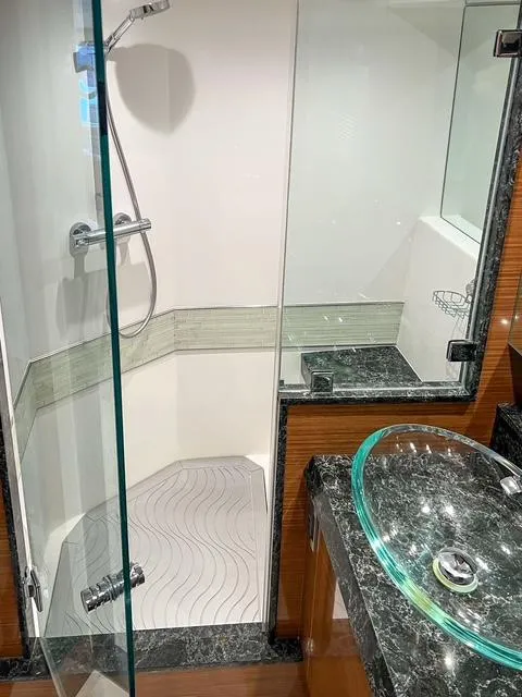 Slide: The Image of Luxurious bathroom in 2018 Ocean Alexander 70E Motoryacht with glass shower and elegant sink. - 43
