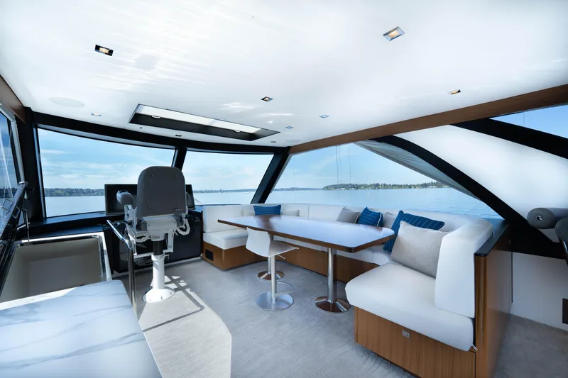 Slide: The Image of Luxurious interior of 2018 Ocean Alexander 70E Motoryacht with panoramic windows and modern seating. - 44