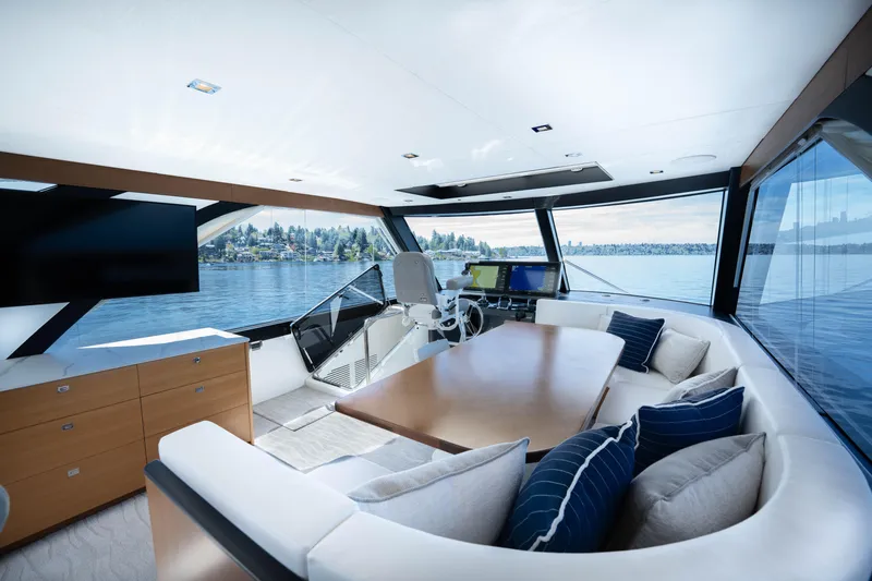 Slide: The Image of Luxurious interior of 2018 Ocean Alexander 70E Motoryacht with panoramic windows and elegant seating. - 46