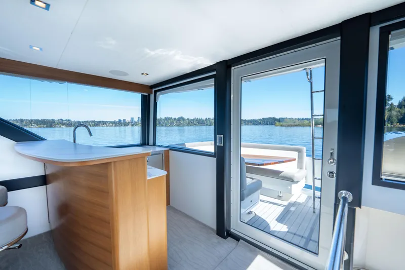 Slide: The Image of Luxurious interior of 2018 Ocean Alexander 70E Motoryacht with scenic water views. - 48