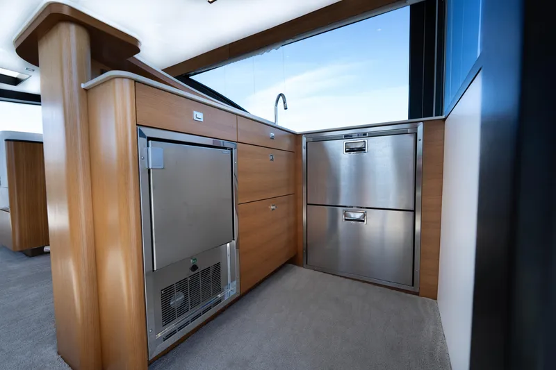 Slide: The Image of Modern kitchen area in 2018 Ocean Alexander 70E Motoryacht with stainless steel appliances. - 50