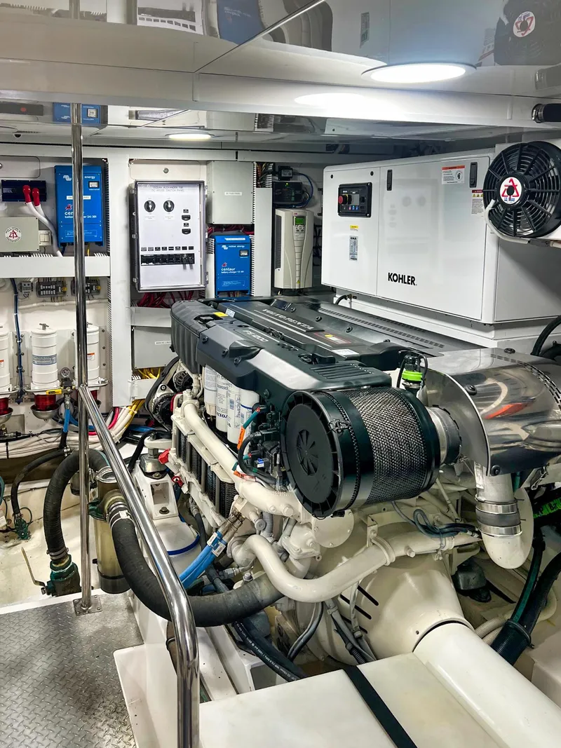 Slide: The Image of Engine room of 2018 Ocean Alexander 70E Motoryacht, featuring advanced machinery and equipment. - 52