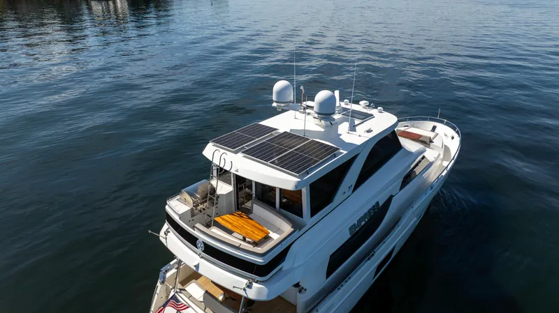 Slide: The Image of 2018 Ocean Alexander 70E Motoryacht cruising on calm waters. - 7