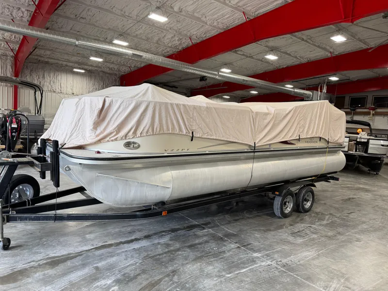 Slide: The Image of Covered 2007 Veranda VP 22 pontoon boat on trailer in indoor storage. - 13
