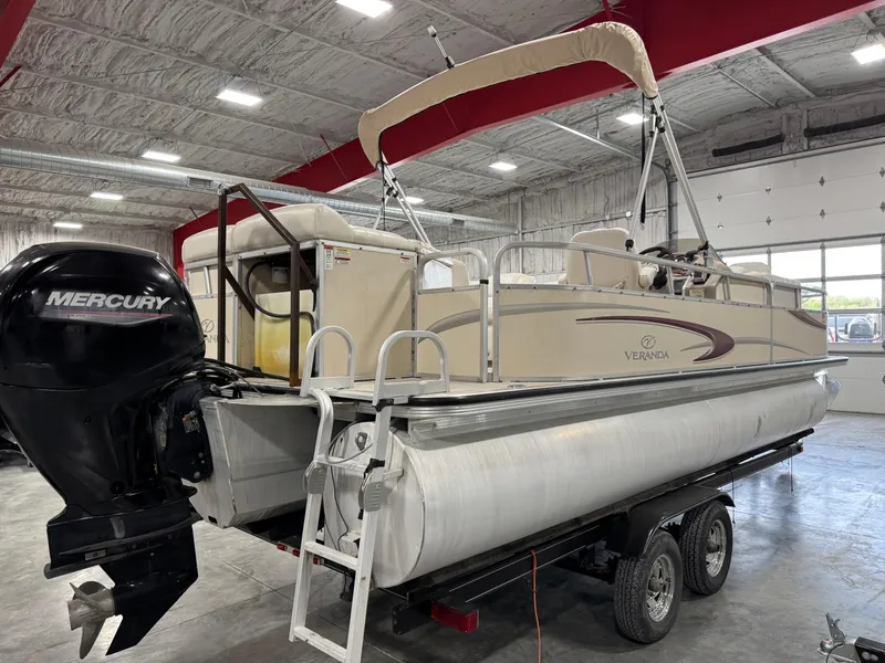 Slide: The Image of 2007 Veranda VP 22 pontoon boat with Mercury engine in a warehouse setting. - 4