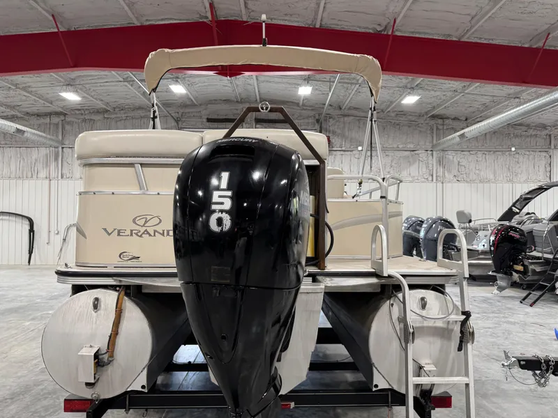 Slide: The Image of 2007 Veranda VP 22 pontoon boat with 150 HP engine in indoor storage. - 5