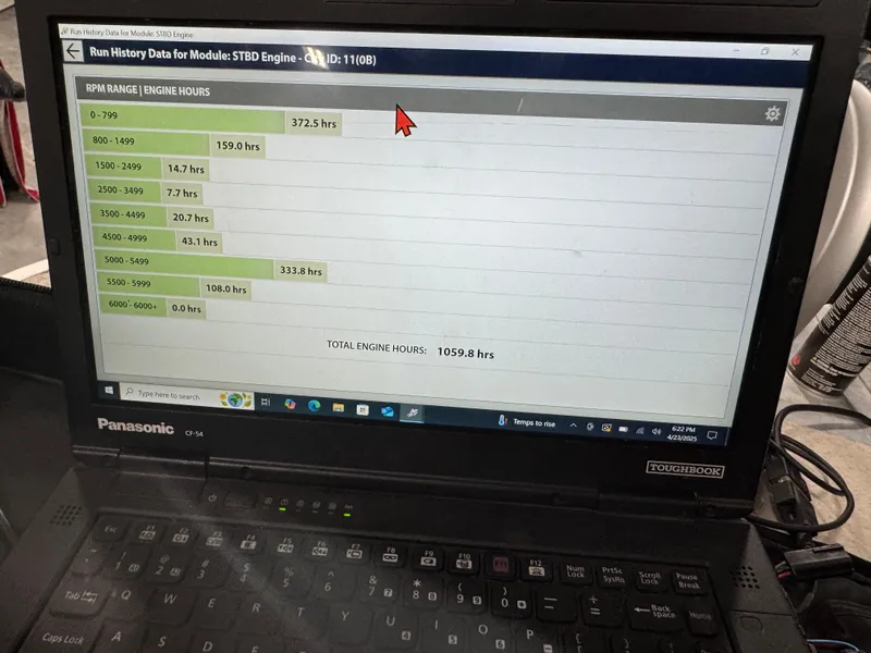 Slide: The Image of Laptop displaying engine run history data for Veranda VP 22, 2007 model. - 6