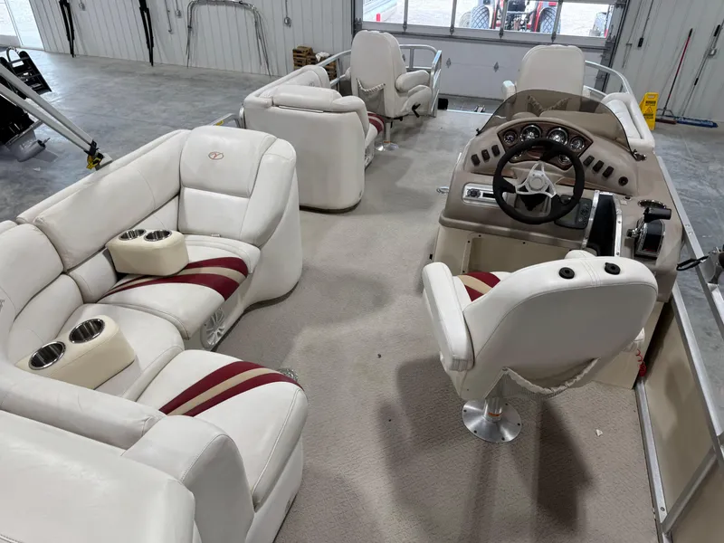 Slide: The Image of Interior of a 2007 Veranda VP 22 pontoon boat with plush seating and steering console. - 7